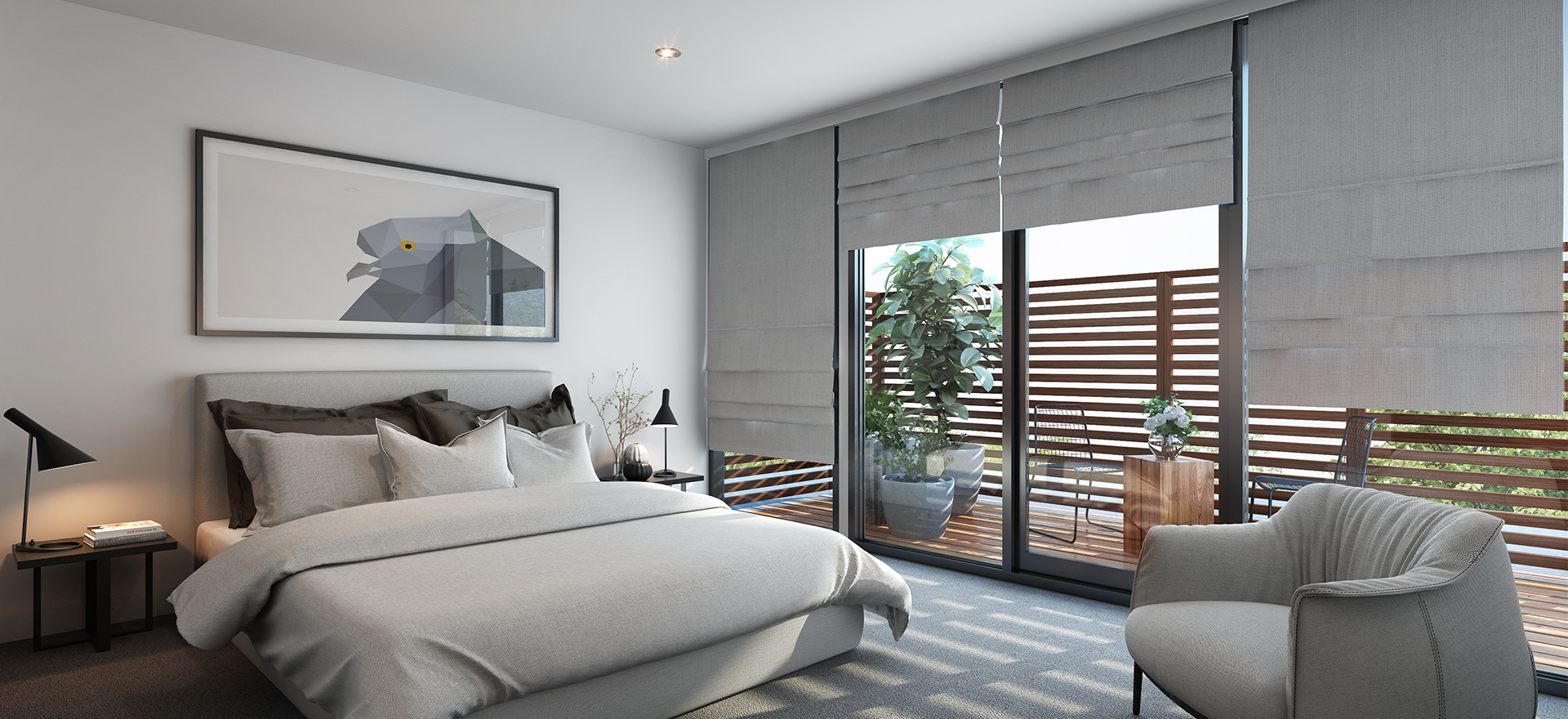 A modern bedroom with a large bed, white bedding, and a gray upholstered chair. The room has a minimalist design with a framed picture on the wall above the bed. There are sliding glass doors leading to a small outdoor patio with plants. The room is well-lit with natural light coming through the windows.